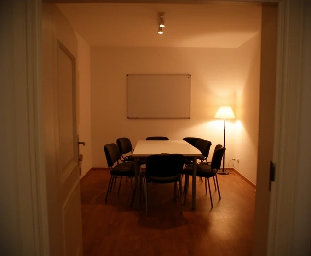 Small meeting room in Leeds set up with eight chairs for an evening workshop